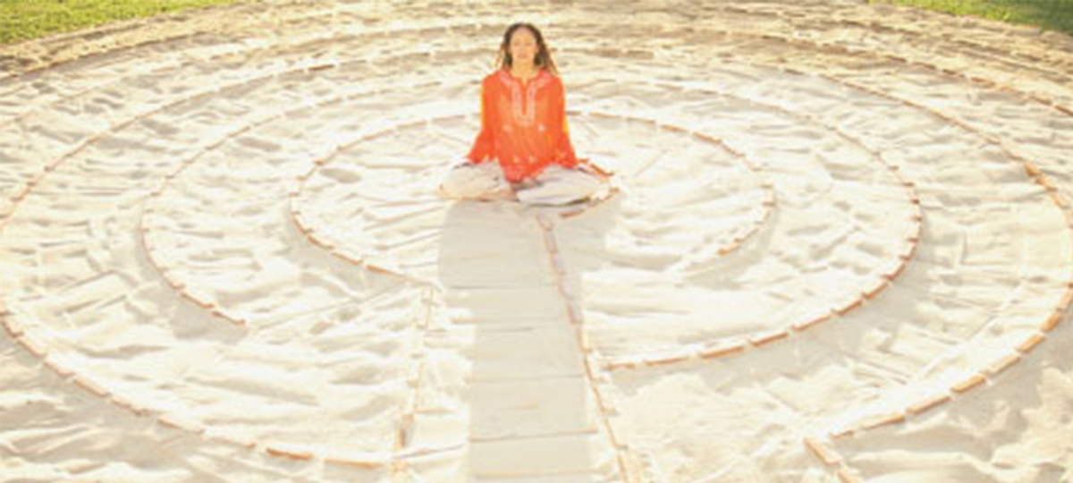 woman sitting in a circle in mediation pose