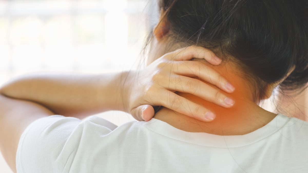 An image of a person massage their own neck which is highlighted red to show it is in pain.