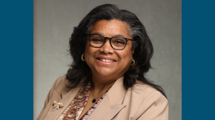 a headshot of Cindy E. Farrar