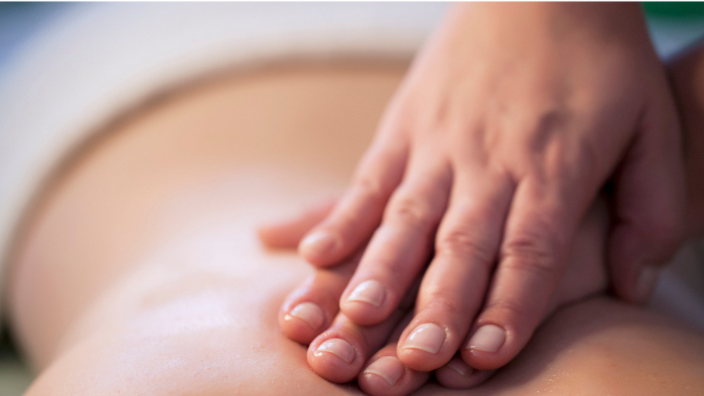 a close-up image of a back massage.