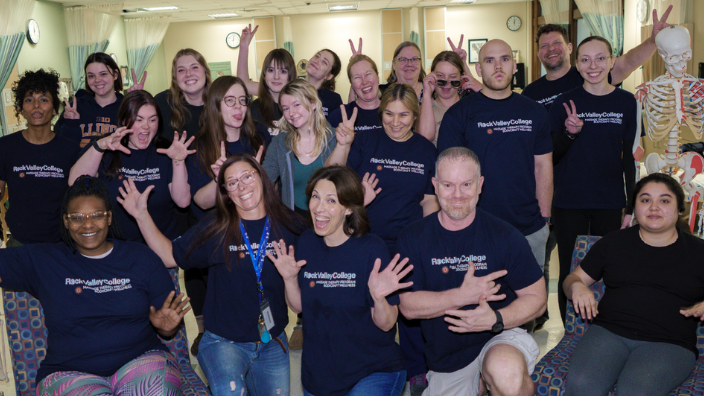an image of a group of massage students smiling togehter.
