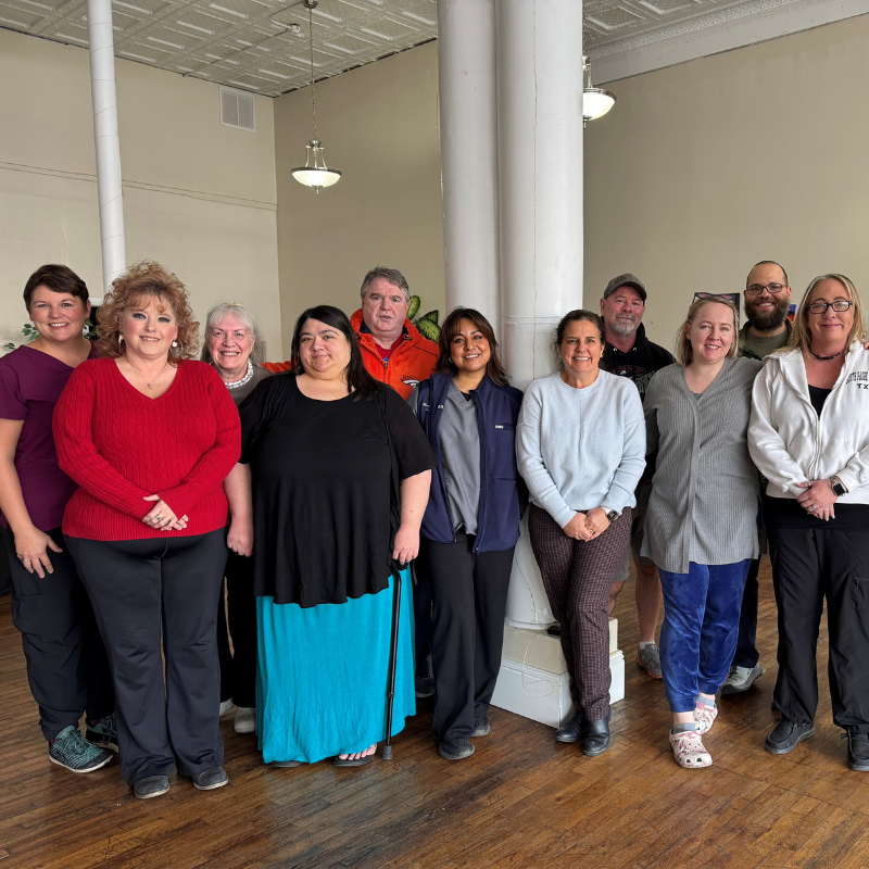 group of adult students smiling for camera
