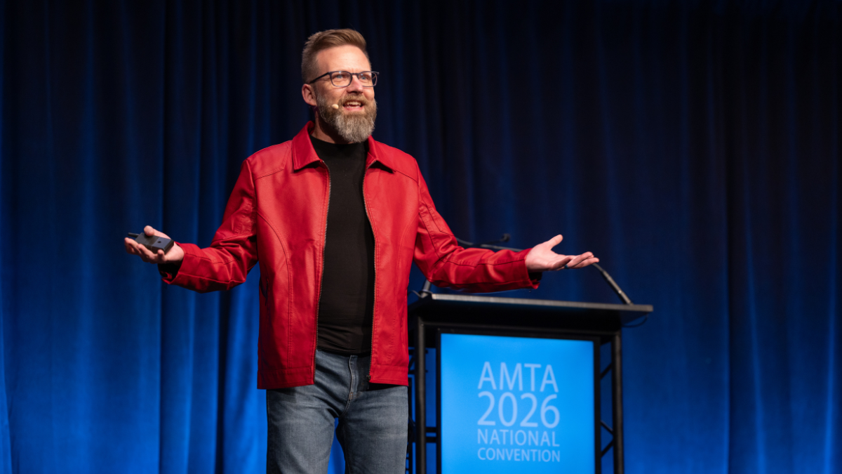 an image of Shawn Ellis speaking on stage.