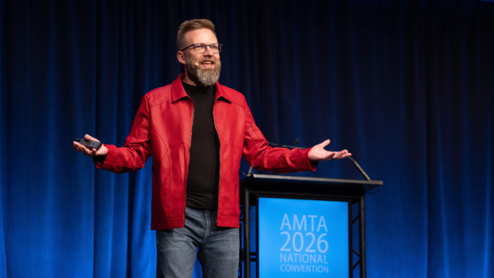 an image of Shawn Ellis presenting on stage.