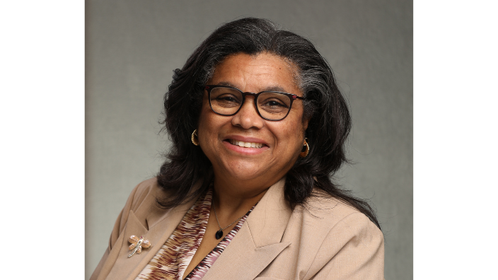 a headshot of Cindy E. Farrar