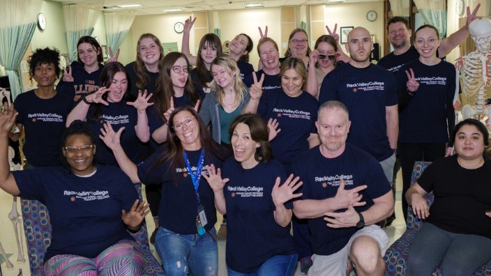 an image of a group of massage students smiling together.