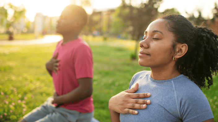 two people doing breathing exercises