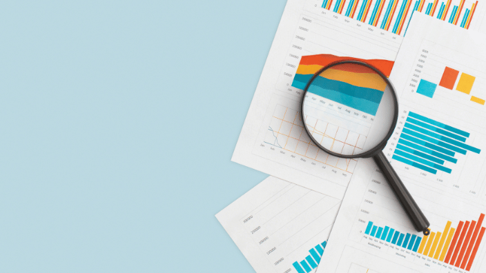 Magnifying glass and research report