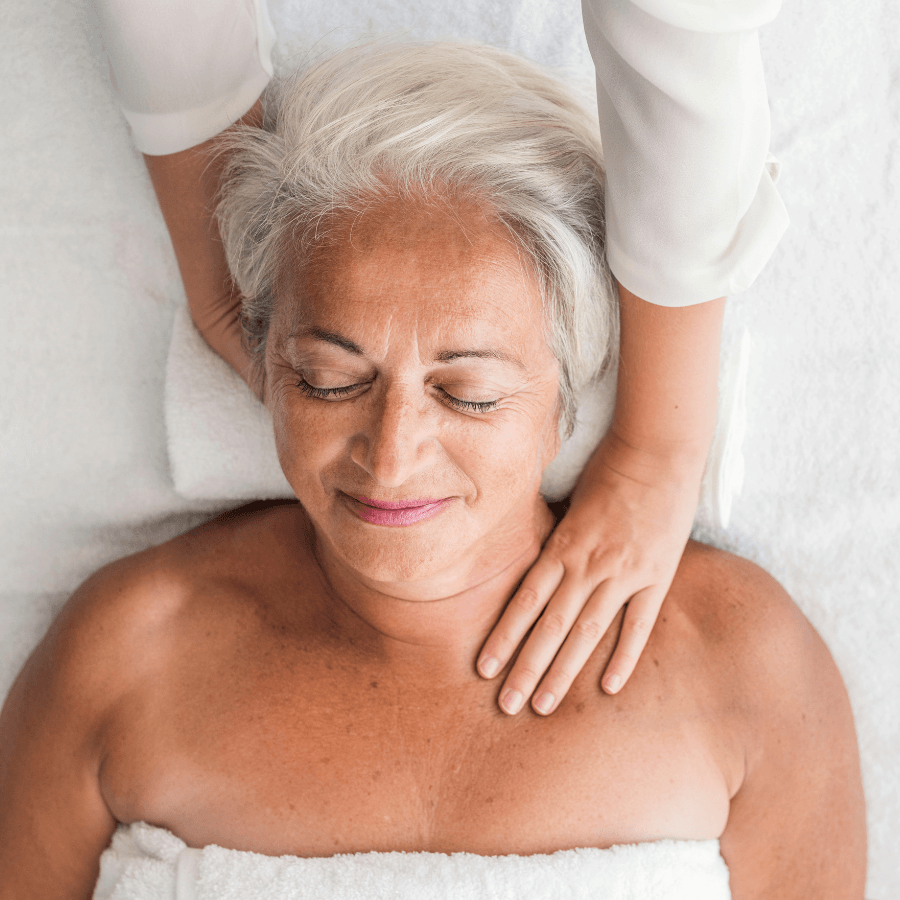 Older woman laying on massage table