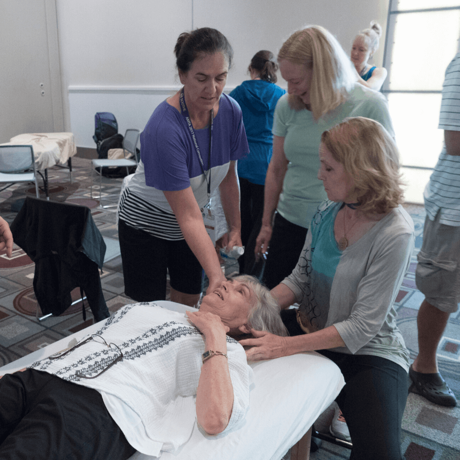 massage educator instructing massage therapists