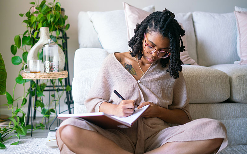 woman writing in a journal