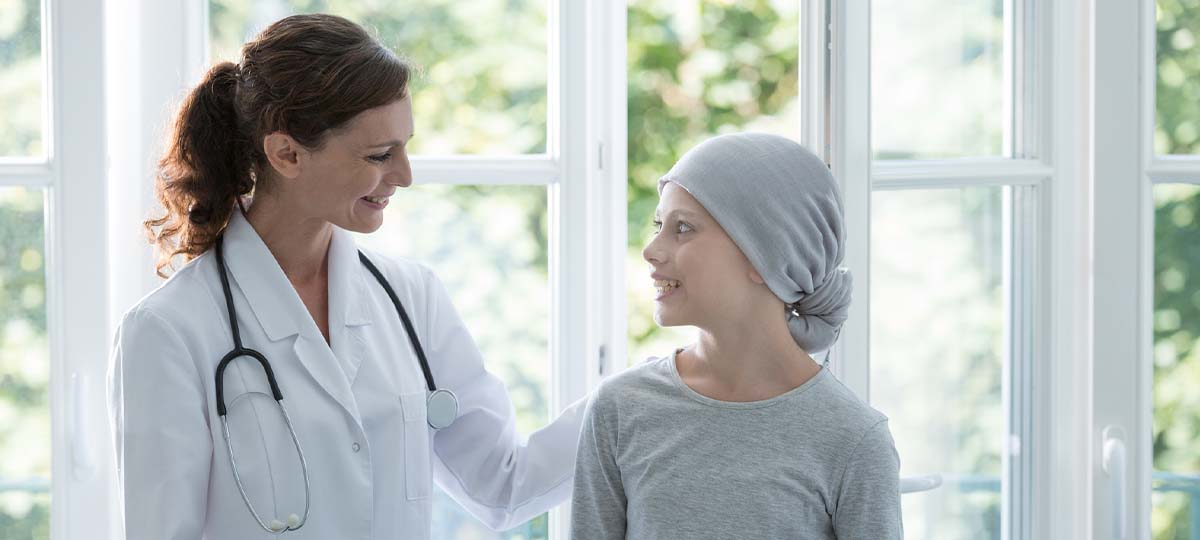 Doctor with young child with head covering