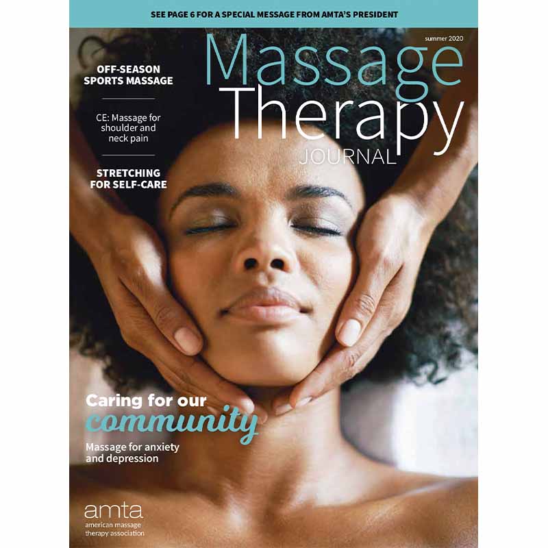 Person laying supine with a massage therapist's hand cupping face