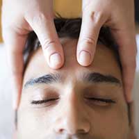 hands on head doing head massage