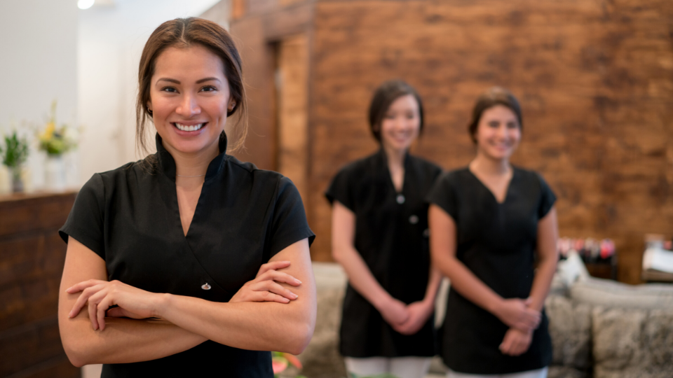 Three female massage therapists