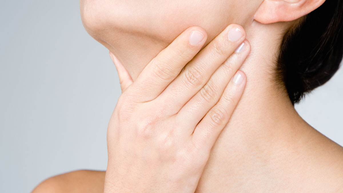 woman massaging her neck
